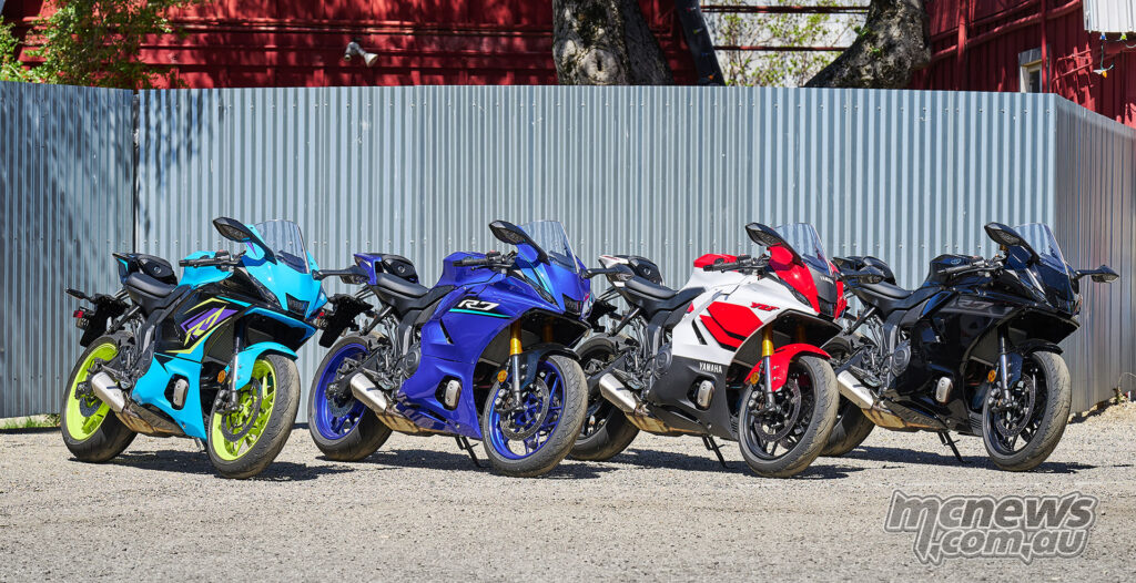 Four 2026 Yamaha YZF-R7 motorcycles parked in a row facing forward.