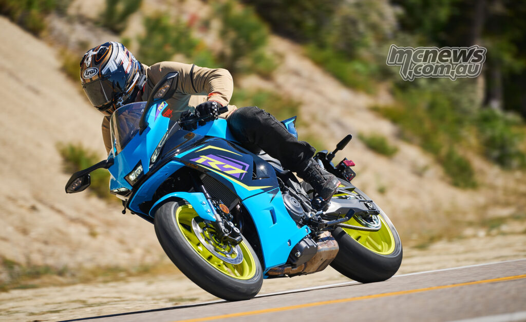 Cyan 2026 Yamaha YZF-R7 leaned hard into a bend during road test.