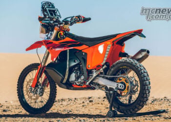 Rear left view of the 2027 KTM 450 Rally Replica in desert setting