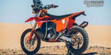 Rear left view of the 2027 KTM 450 Rally Replica in desert setting
