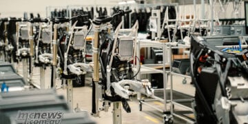 Stark Future motorcycle chassis and assembly stations inside the Barcelona manufacturing facility.
