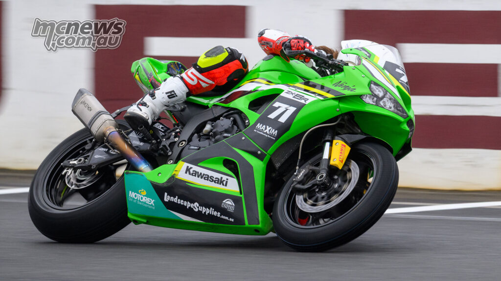 Tom Edwards rides the green number 71 Kawasaki ZX-6R through Morgan Park during ASBK Next Gen Supersport action.