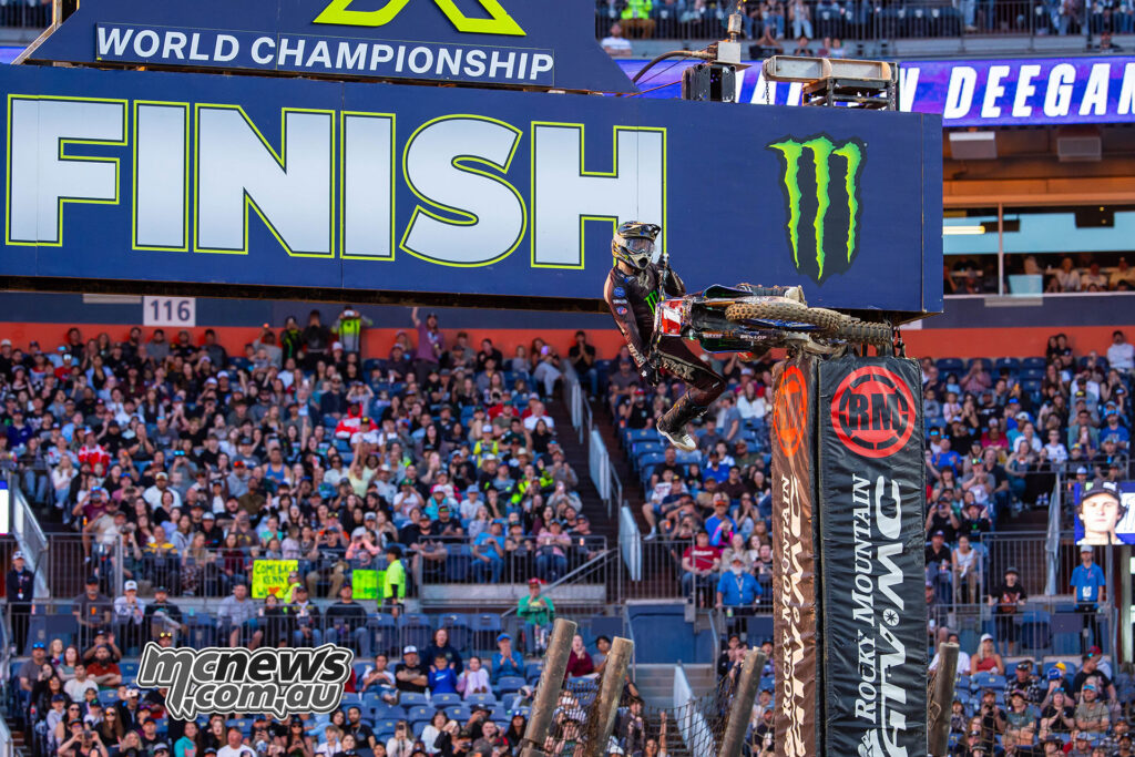 Haiden Deegan jumping under the finish line after winning the 250SX West Main Event at Denver Supercross 2026.