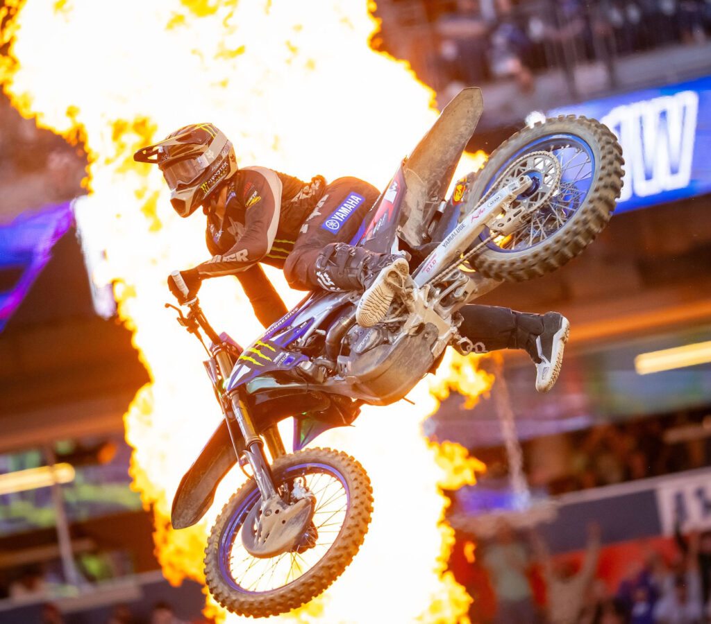 Haiden Deegan on his Yamaha in front of flames after winning the 250SX West Main Event in Denver.
