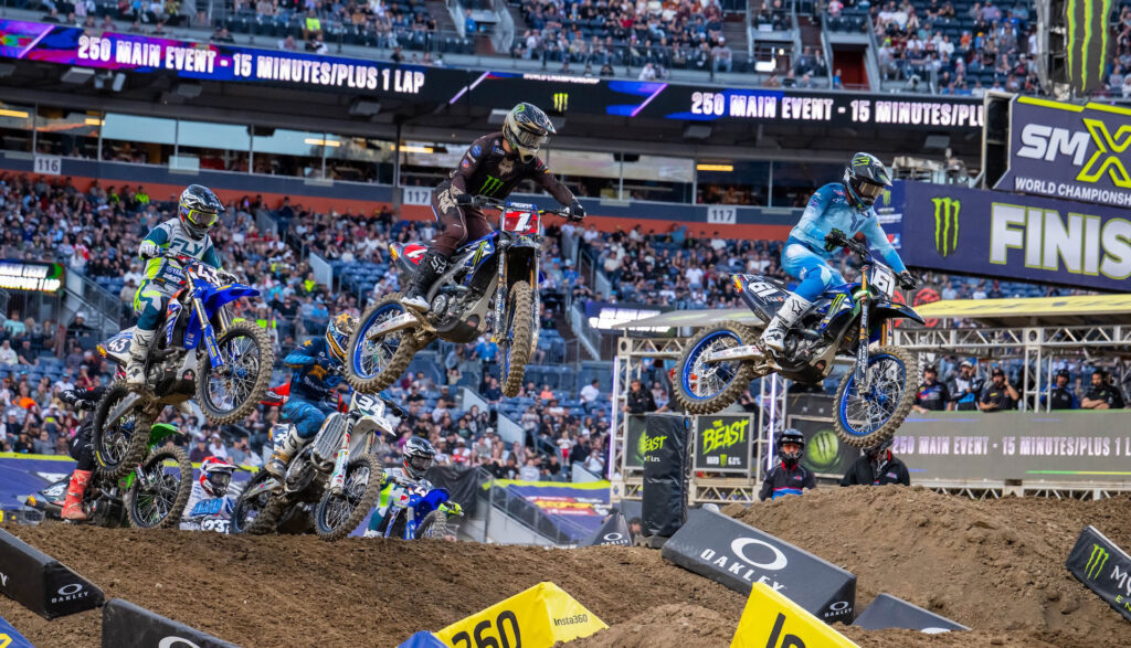 Start of the 250SX West Main Event at Denver Supercross 2026 with Haiden Deegan and the field launching from the gate.