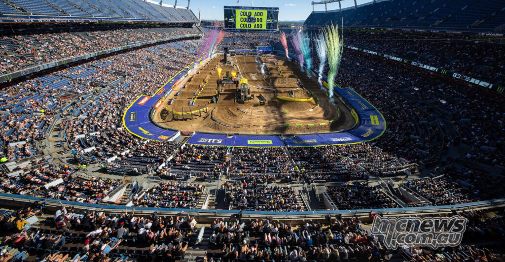 Wide view of Empower Field at Mile High during Denver Supercross 2026 with fireworks over the track.