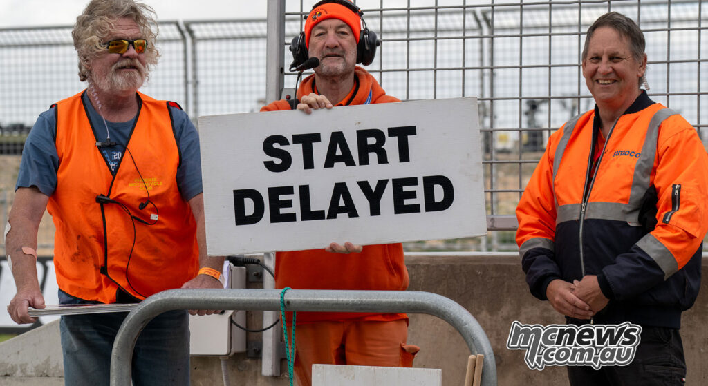 ASBK officials holding a Start Delayed board before Supersport Race Two at The Bend