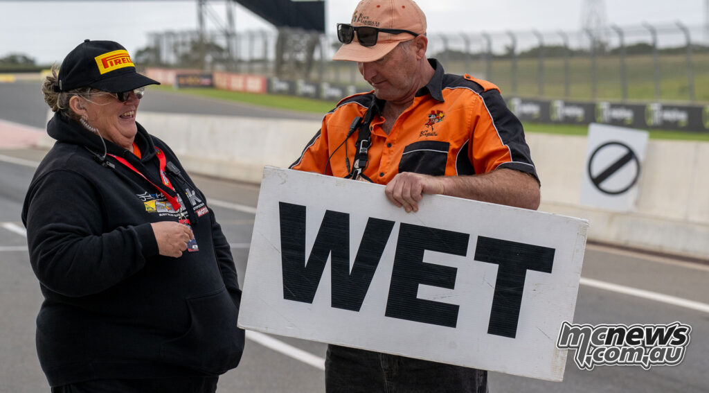 ASBK officials holding a Wet board before Supersport Race Two at The Bend
