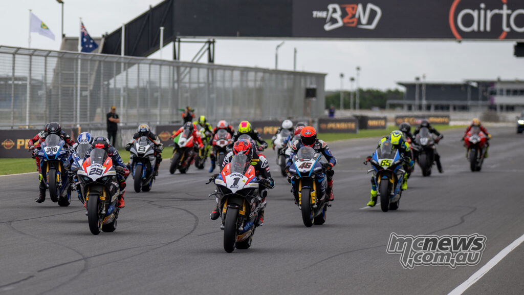 ASBK Superbike Race Two field launches from the grid at The Bend
