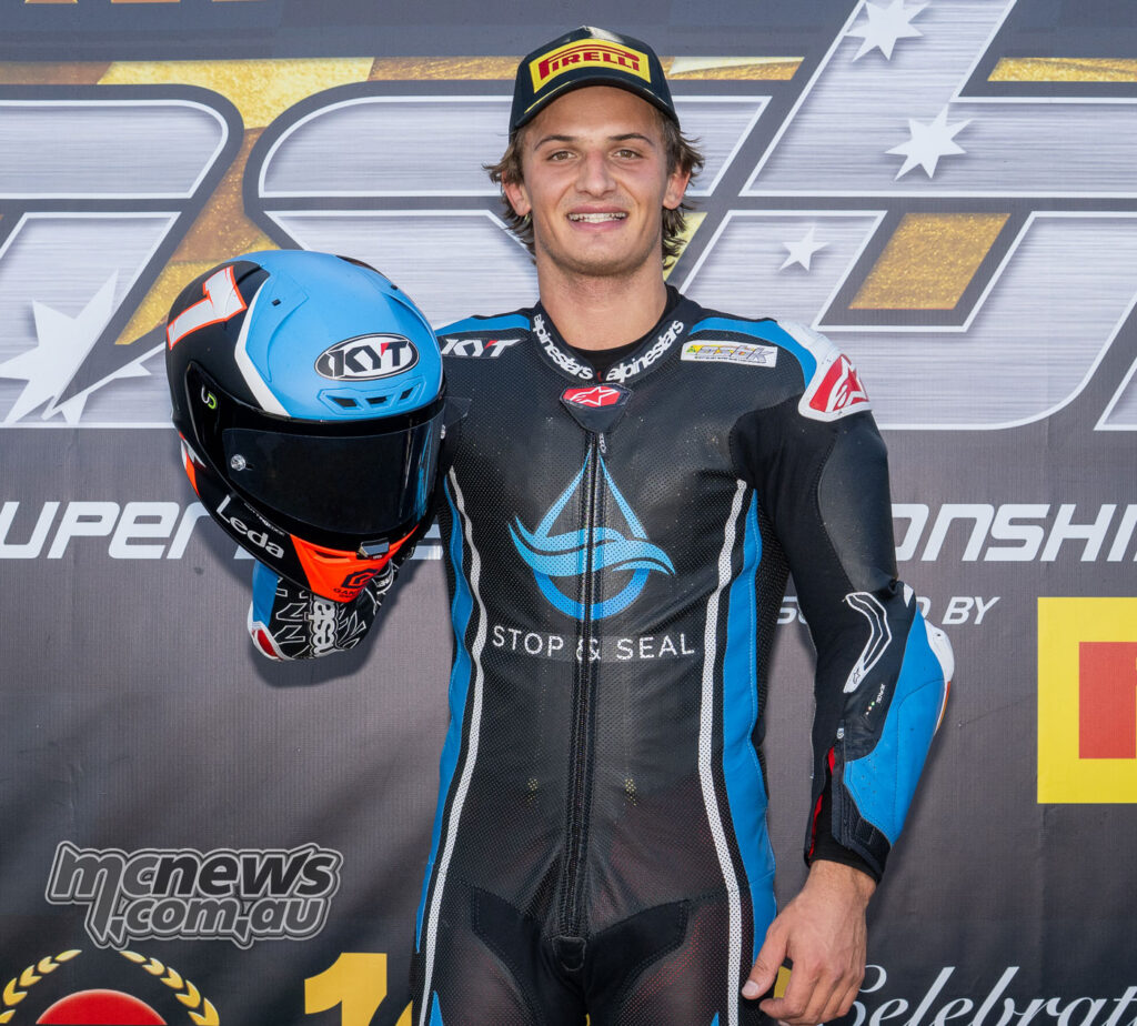 Tom Toparis holding the race winner’s trophy after winning Supersport Next Gen Race One at The Bend