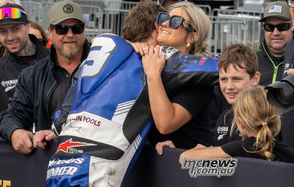 Cam Dunker being congratulated by family and supporters after winning ASBK Superbike Race One at The Bend
