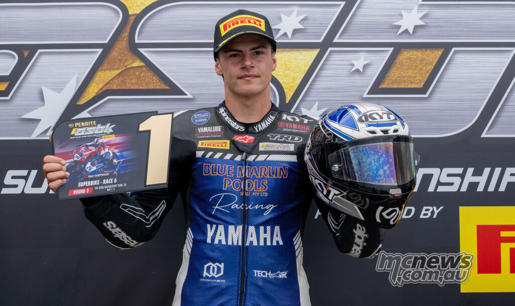 Cam Dunker holding the race winner’s plaque after his first ASBK Superbike victory at The Bend