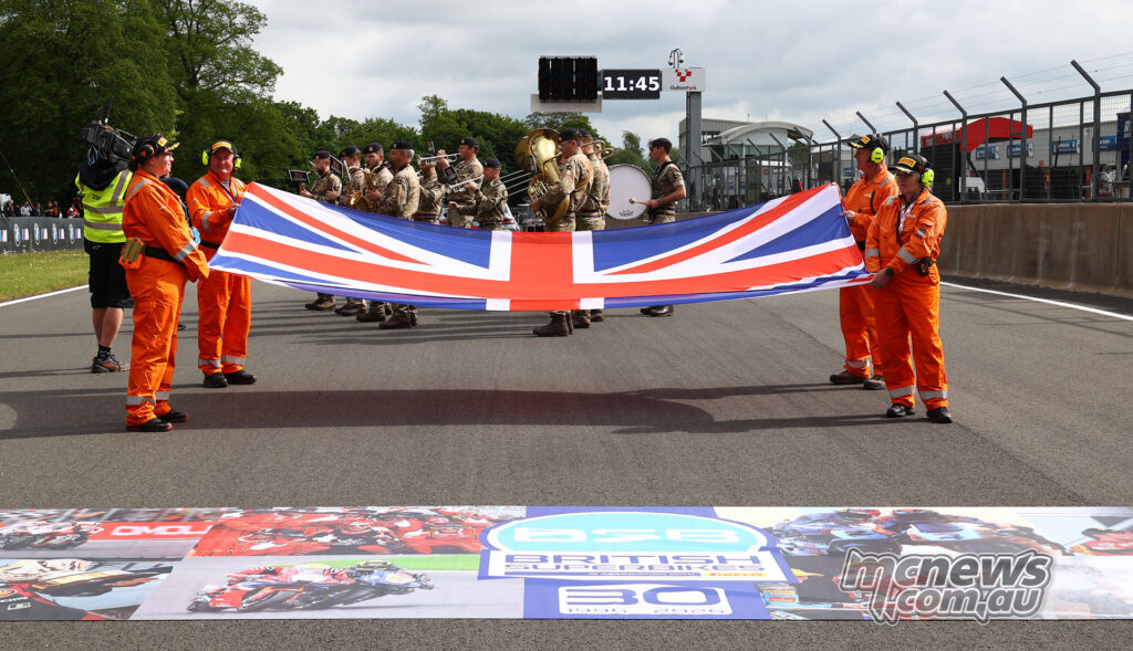Union Jack flag ceremony on the Oulton Park start-finish straight before British Superbike racing.