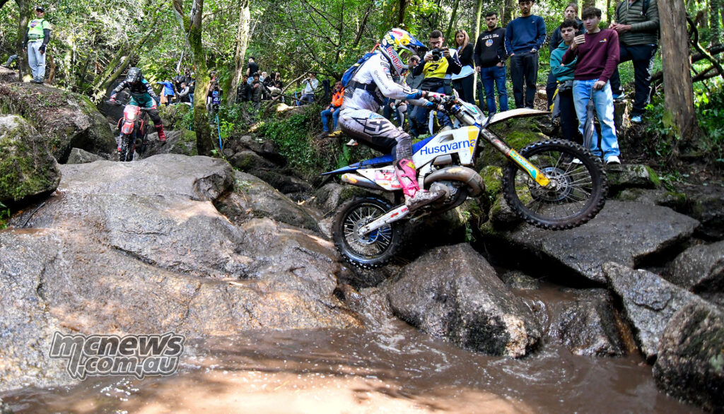 Billy Bolt rides across wet rocks and water on his Husqvarna at Extreme XL Lagares.