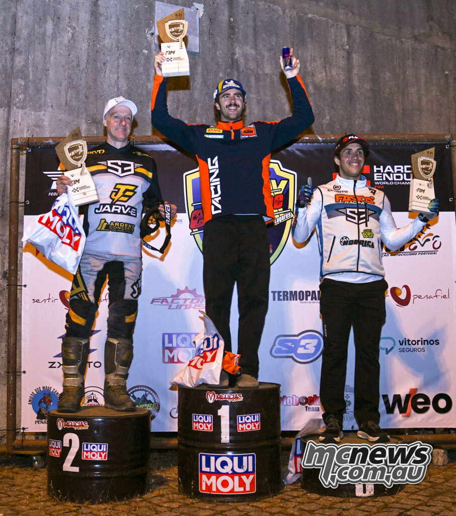 Manuel Lettenbichler celebrates on the Friday Endurocode Stage podium with Graham Jarvis and Mario Román.