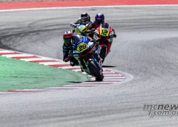 Harrison Voight leading Jacob Roulstone through a Catalunya corner in Moto2 competition.