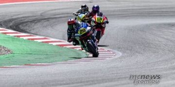 Harrison Voight leading Jacob Roulstone through a Catalunya corner in Moto2 competition.