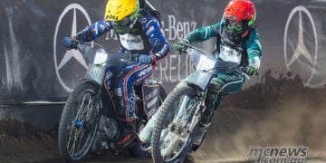 Brady Kurtz and Leon Madsen race side-by-side on the dirt track at the 2026 FIM Speedway GP of Czech Republic in Prague.