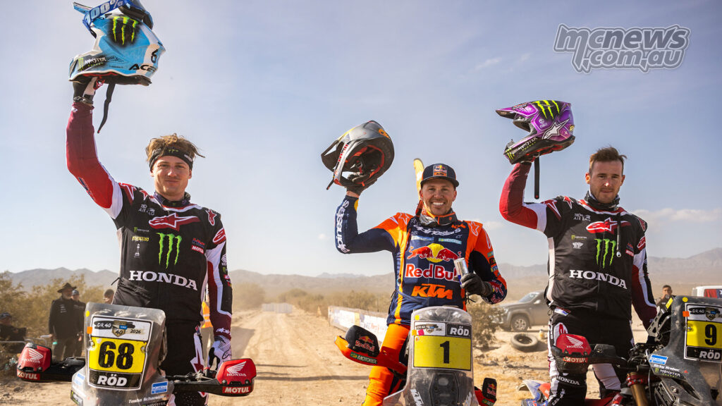 Tosha Schareina, Daniel Sanders and Ricky Brabec celebrate on the RallyGP podium at the 2026 Desafío Ruta 40.