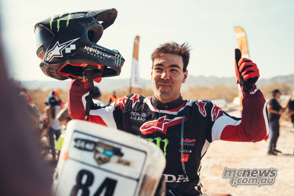 Martim Ventura holds his helmet and gives a thumbs up after winning Rally2 at the 2026 Desafío Ruta 40.