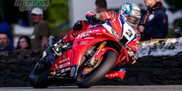 Dean Harrison leaning the Honda Racing UK Superbike through a right-hander at TT 2026.