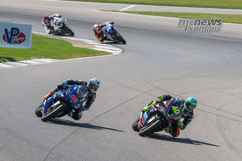 Sean Dylan Kelly passes Bobby Fong during MotoAmerica Superbike race two at Barber.
