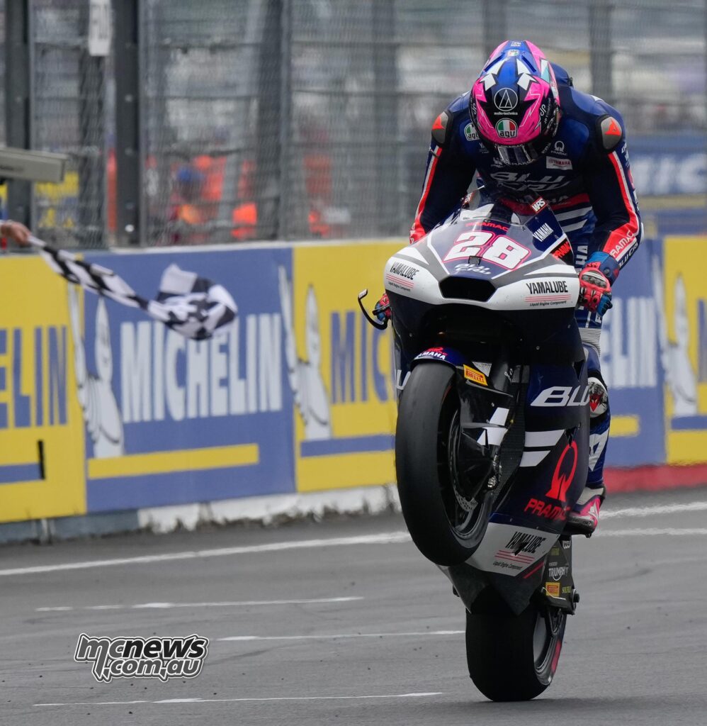 Izan Guevara performs a wheelie after winning the Moto2 race at Le Mans.