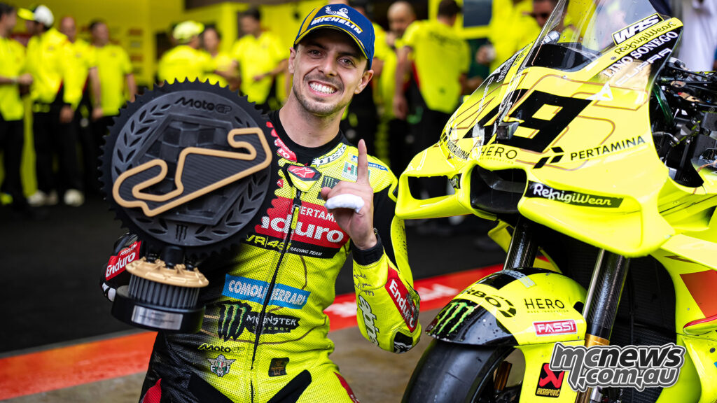 Fabio Di Giannantonio poses with the MotoGP winner’s trophy beside his VR46 Ducati.