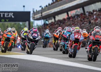 Moto2 riders launch from the grid at the Catalan Grand Prix.
