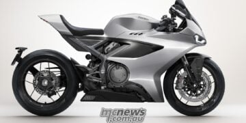 2026 Norton Manx R silver V4 superbike shown in full right-side studio profile with carbon-fibre accents.
