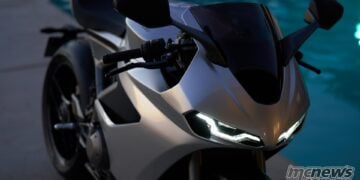 Close-up front view of the 2026 Norton Manx R showing its LED headlights, mirrors and tinted screen.