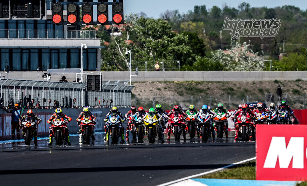 WorldSBK riders line up under red lights for the start of Race 1 at Balaton Park.