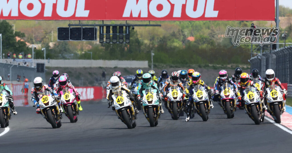 WorldWCR riders launch toward Turn 1 at the start of Race 1 at Balaton Park.
