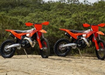2027 KTM 300 XC and 2027 KTM 125 XC two-stroke off-road motorcycles parked together