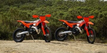 2027 KTM 300 XC and 2027 KTM 125 XC two-stroke off-road motorcycles parked together