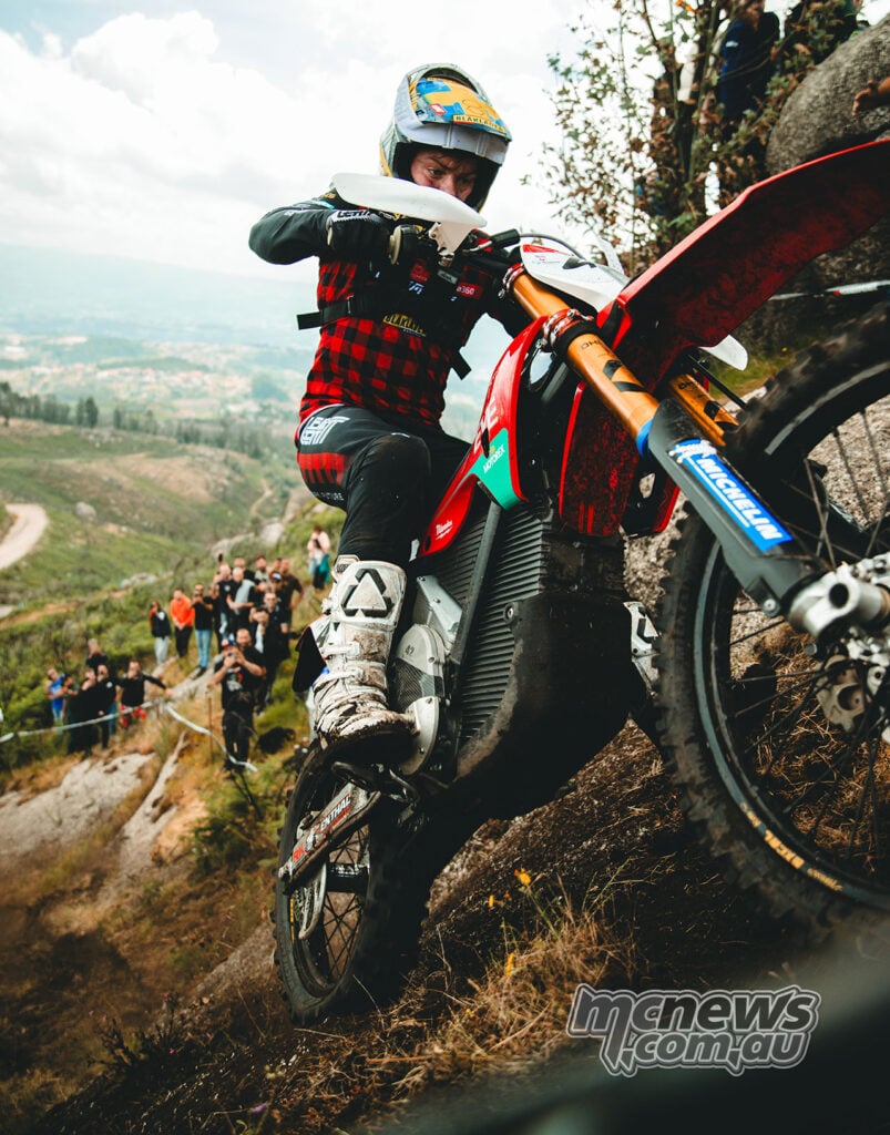 Stark VARG electric enduro bike being ridden up a steep rocky hill climb.
