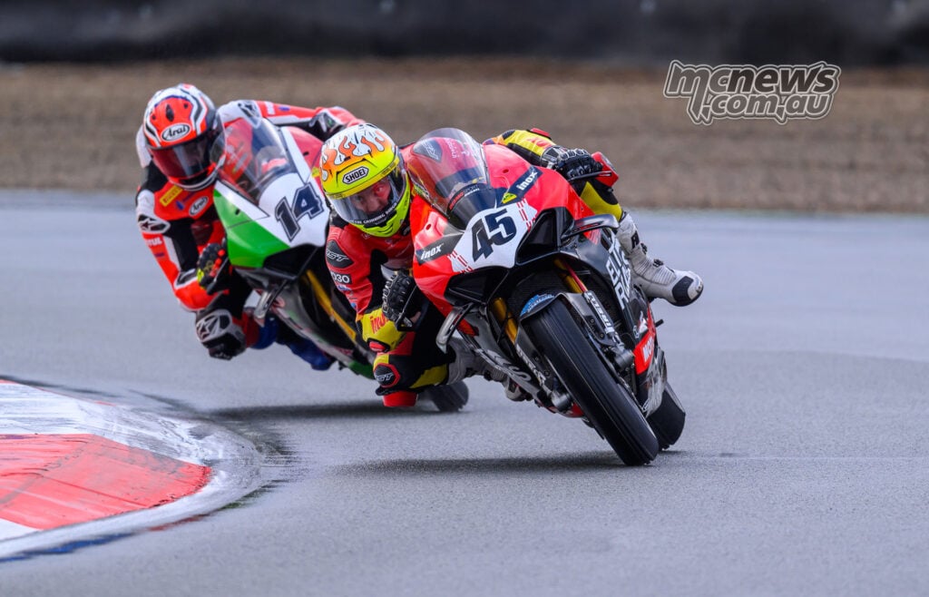 Olly Simpson ahead of Glenn Allerton during wet Superbike Race Two at Queensland Raceway.