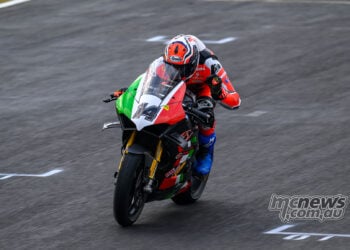 Glenn Allerton crossing the finish line to win wet ASBK Superbike Race Two.