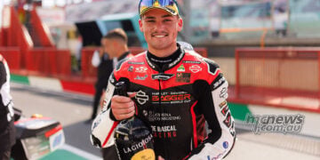 Archie McDonald smiling in parc ferme after finishing third in Race Two at Mugello.