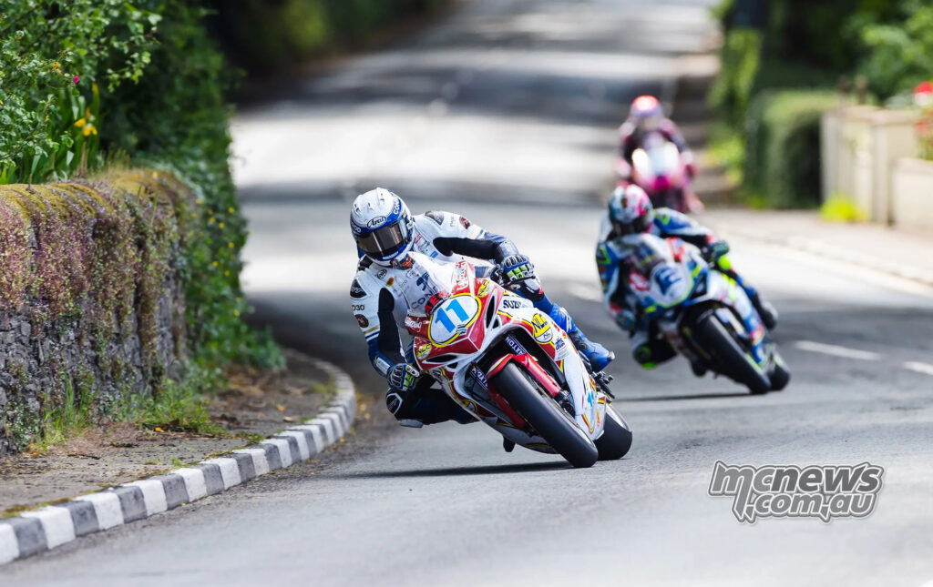 Conor Cummins leads Ian Hutchinson and another rider during Supersport TT Race 1 at the Isle of Man TT.