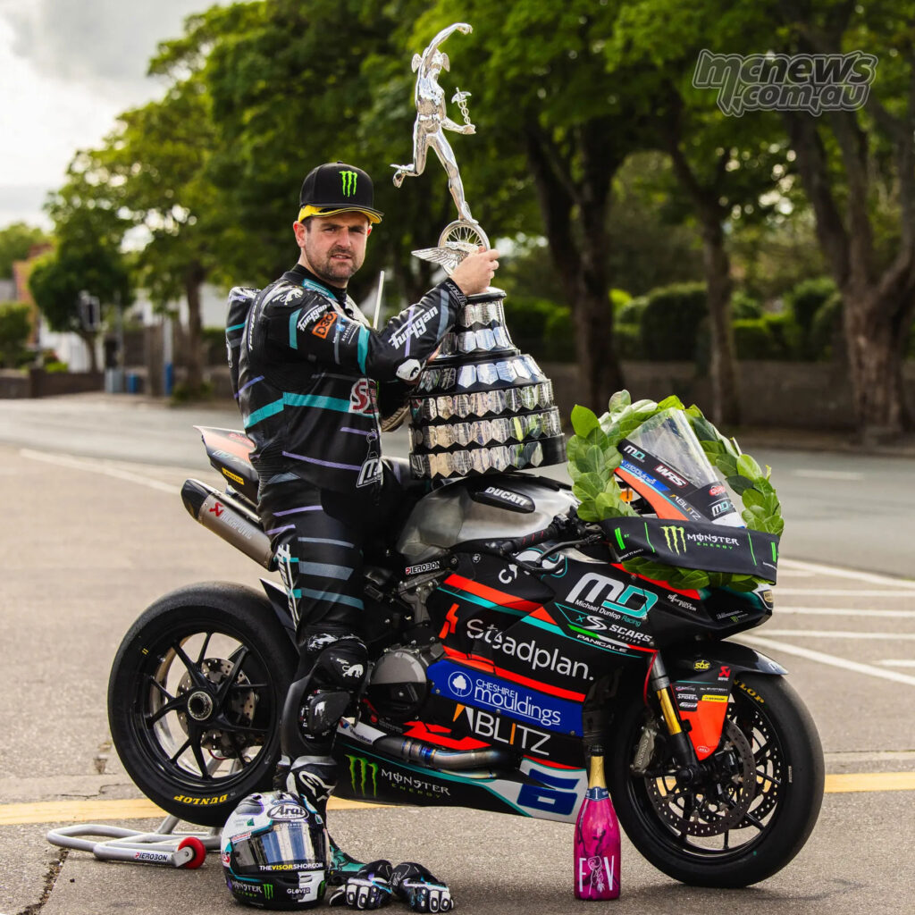 Michael Dunlop sits with the Supersport TT trophy on his Ducati Panigale V2 after winning Race 1.