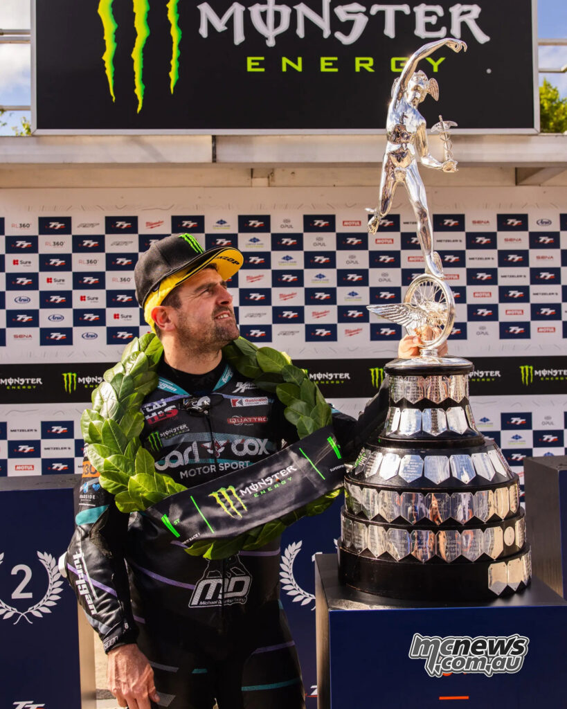 Michael Dunlop holds the Supersport TT winner’s trophy after taking victory in Race 1.