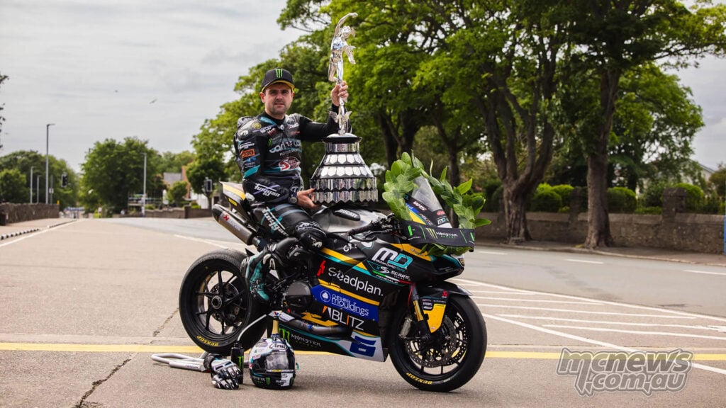 Michael Dunlop poses with the Supersport TT trophy on his winning Ducati Panigale V2.