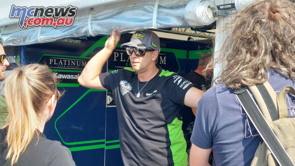 Davo Johnson speaking with media in the Platinum Club Kawasaki awning at the 2026 Isle of Man TT.