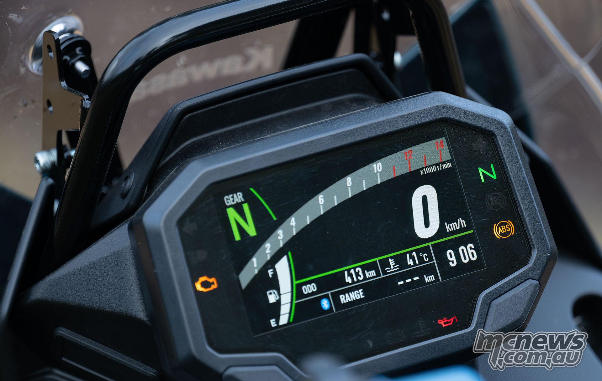 Close-up of the Kawasaki KLE500 SE colour TFT dashboard showing neutral and zero speed.