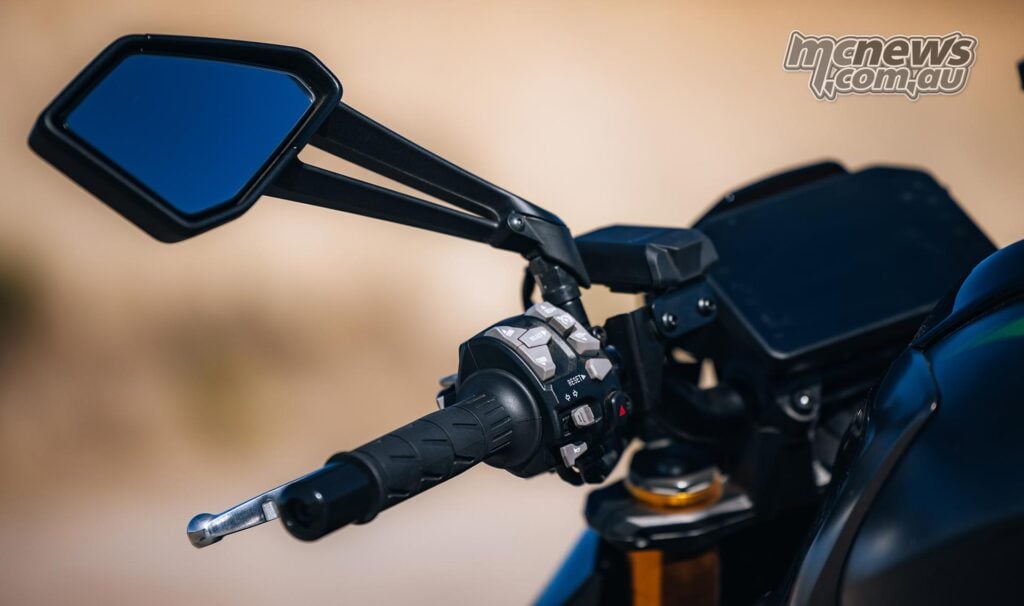 Close-up of the Kawasaki Z1100 SE ABS left handlebar switchgear, mirror and TFT display housing.