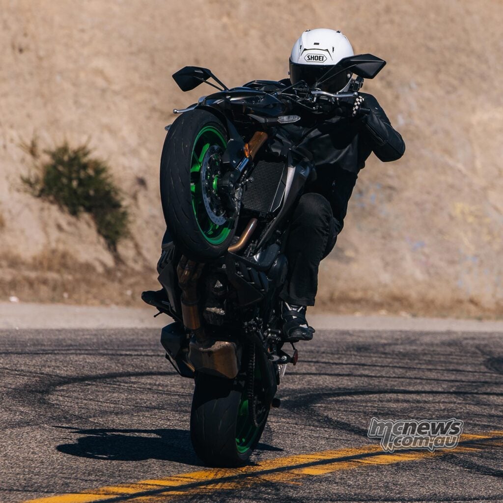 Square crop of a rider performing a wheelie on the 2026 Kawasaki Z1100 SE ABS.