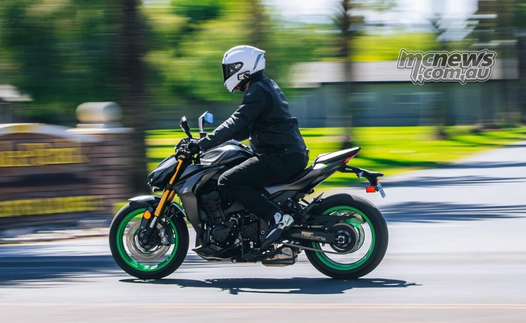 Side-on panning image of the 2026 Kawasaki Z1100 SE ABS being ridden on the road.