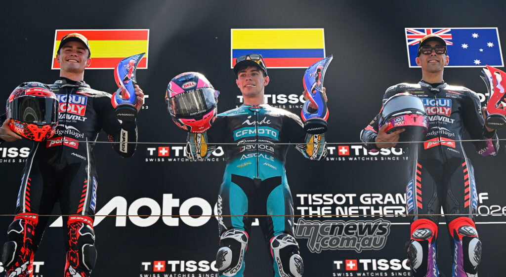 David Alonso celebrating Moto2 victory on the Assen podium with Manuel Gonzalez and Senna Agius.