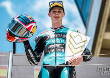 Maximo Quiles holds his Moto3 winner’s trophy on the Hungarian Grand Prix podium.